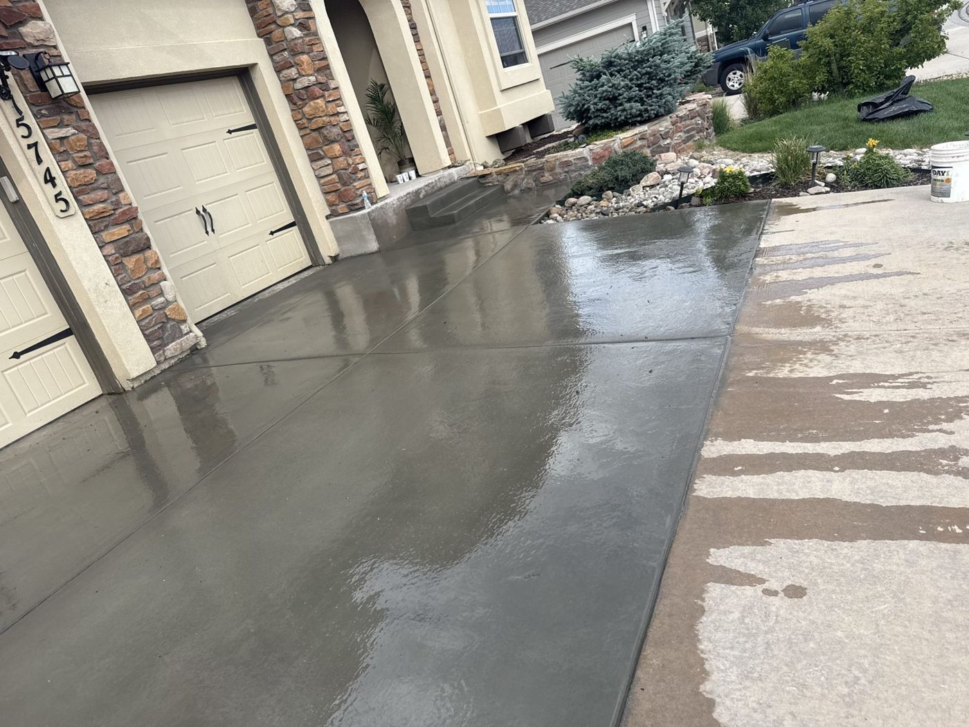 New driveway, stone-column home