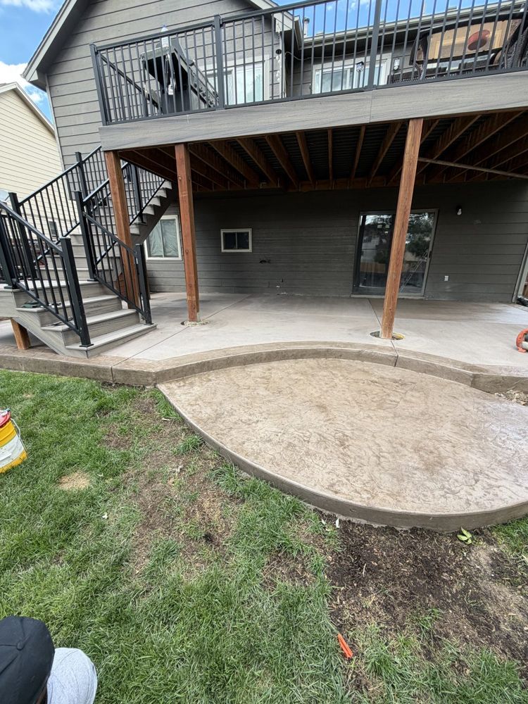 Curved stamped patio under deck