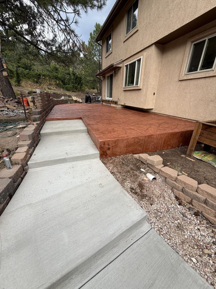 Walkway meeting stamped patio