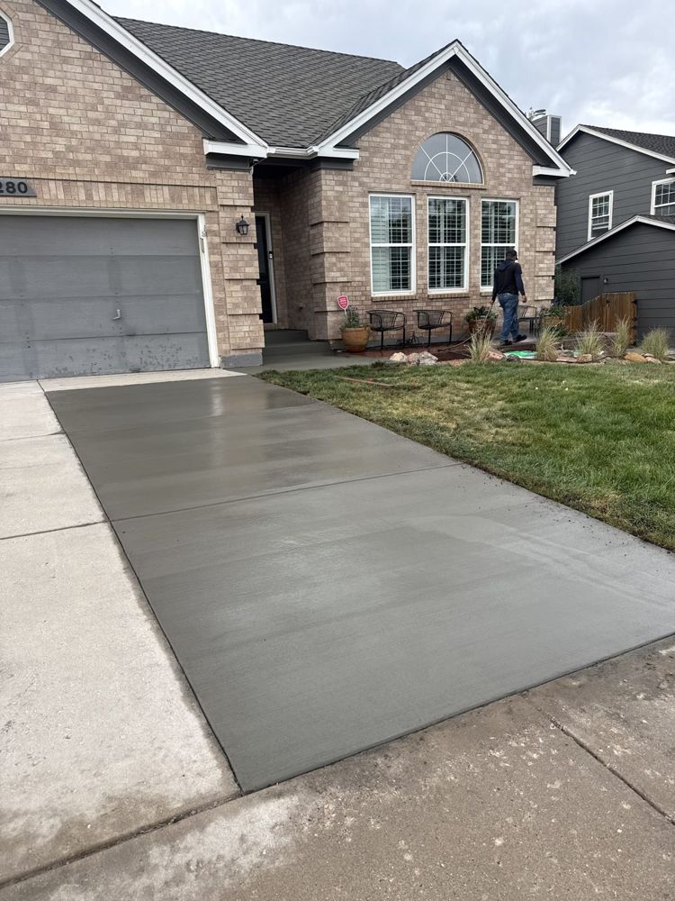 Wet new driveway, brick ranch