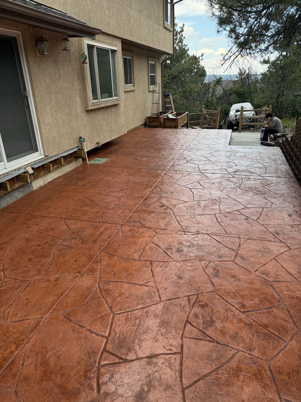 Sealed terracotta stamped flagstone patio