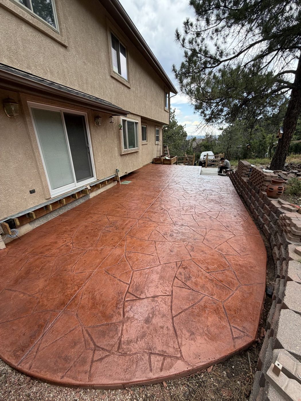 Terracotta flagstone toward the pines