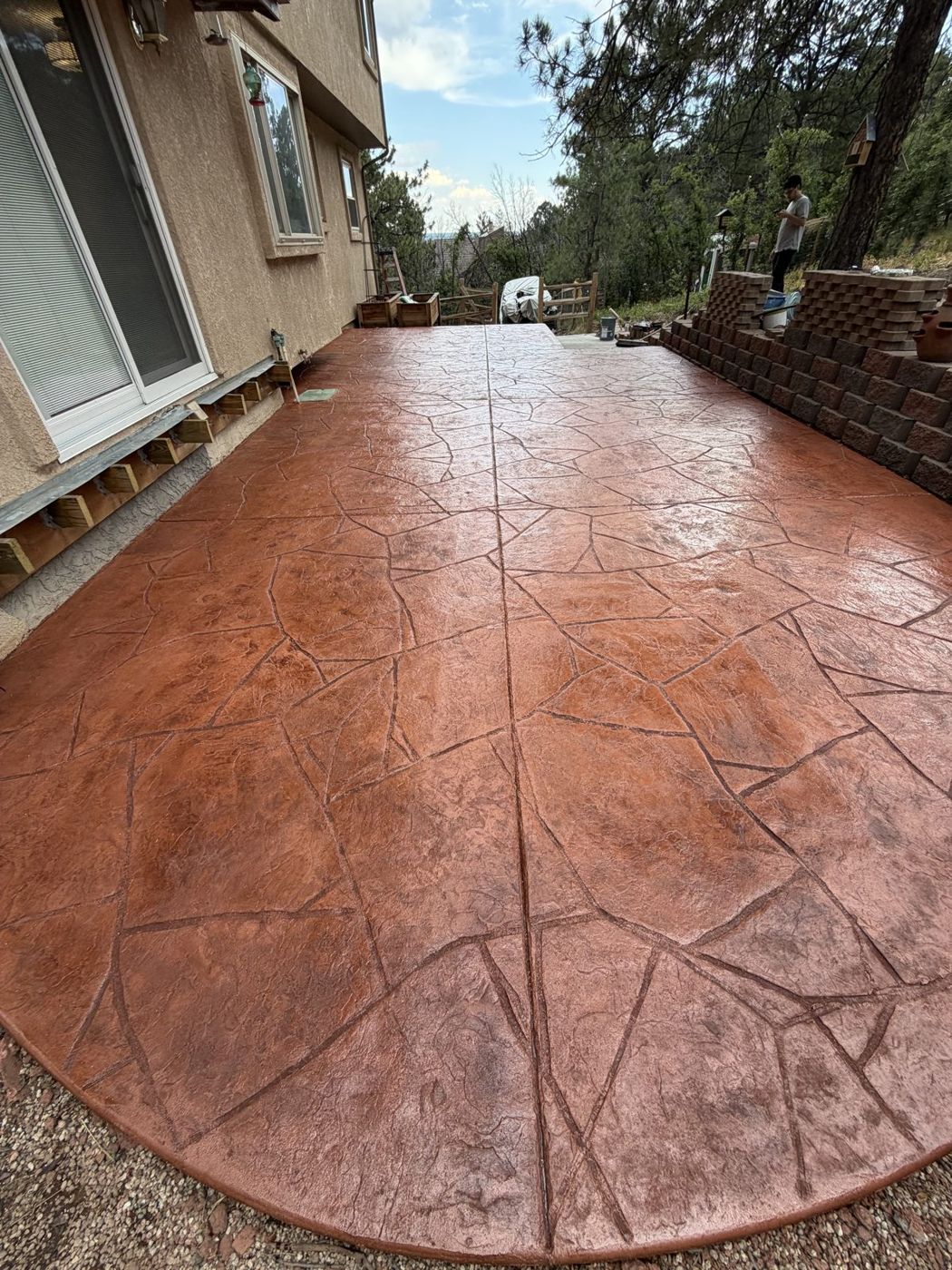Flagstone patio, wide, with retaining wall